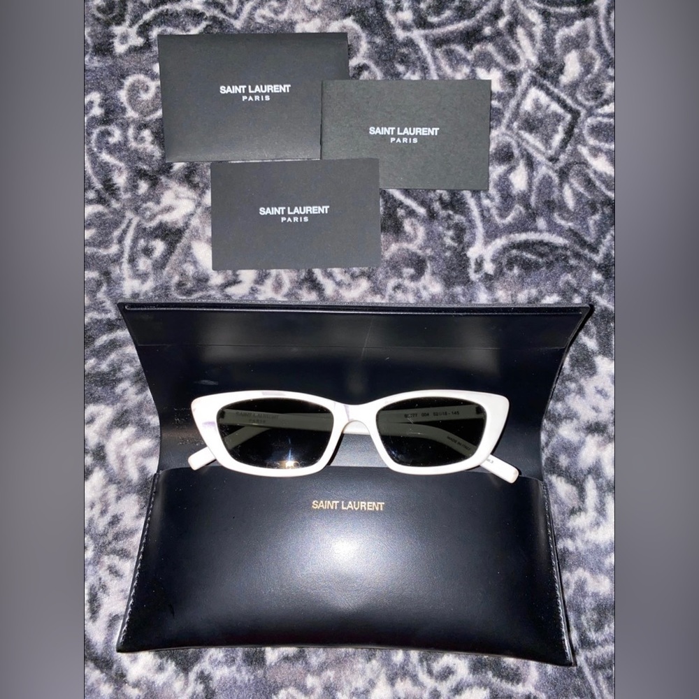 Saint Laurent white cat eye in very good condition, comes with case.